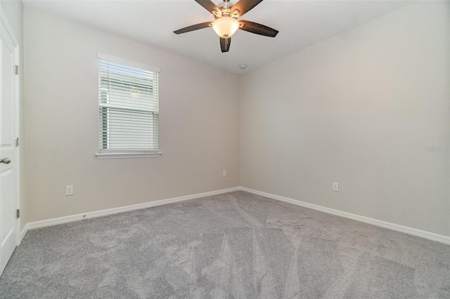 empty room featuring light carpet and ceiling fan