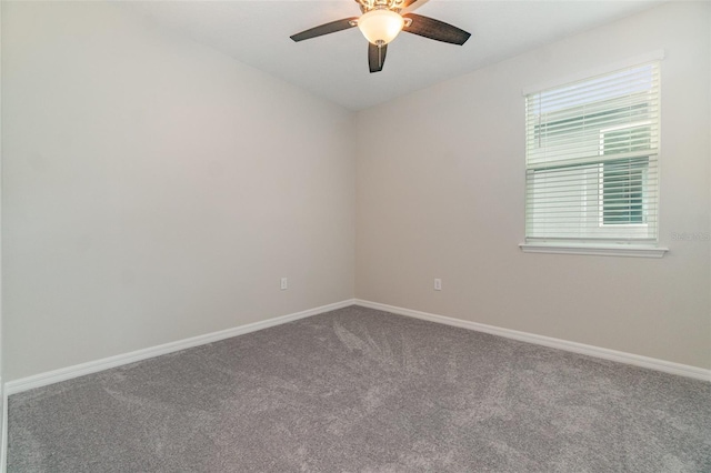 spare room with ceiling fan and carpet flooring