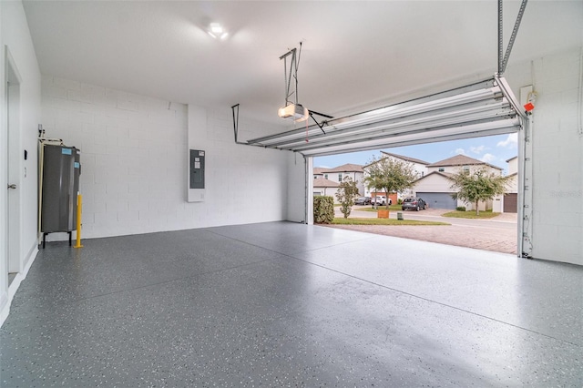 garage featuring electric panel and a garage door opener