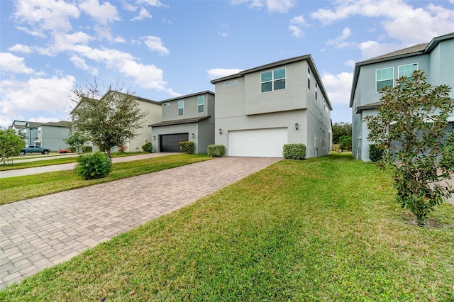 view of front facade featuring a front yard and a garage