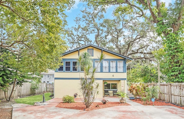 back of property with a patio