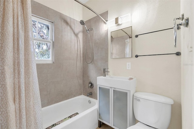 full bathroom featuring toilet, shower / bathtub combination with curtain, and vanity