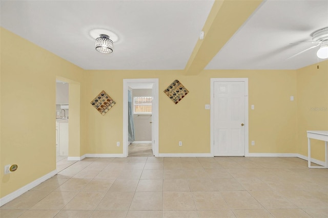 unfurnished room featuring ceiling fan and light tile patterned floors