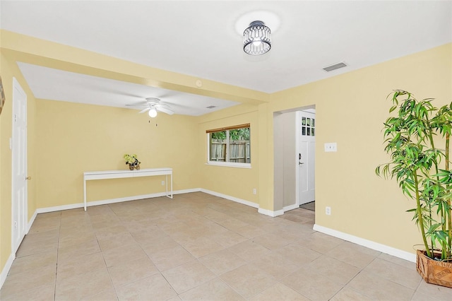 tiled empty room with ceiling fan