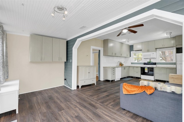 kitchen featuring white appliances, dark hardwood / wood-style floors, decorative backsplash, ornamental molding, and ceiling fan