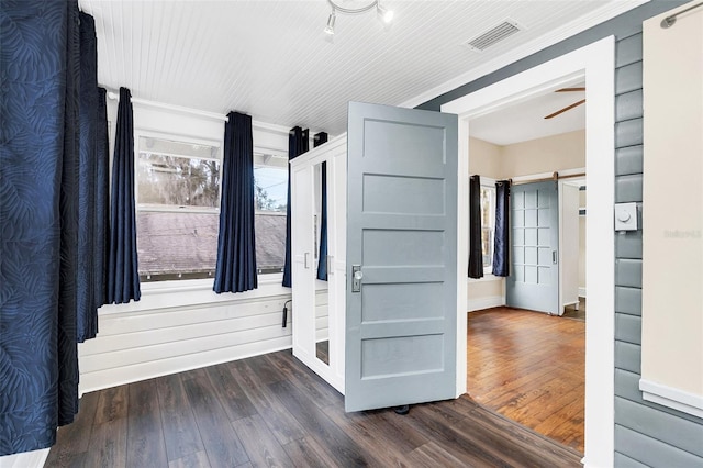 bathroom with ceiling fan and hardwood / wood-style flooring