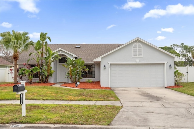 ranch-style house with a garage and a front lawn