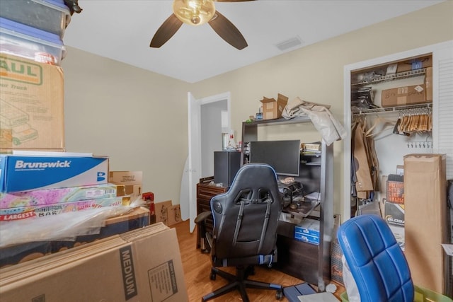 office space with ceiling fan and light hardwood / wood-style flooring