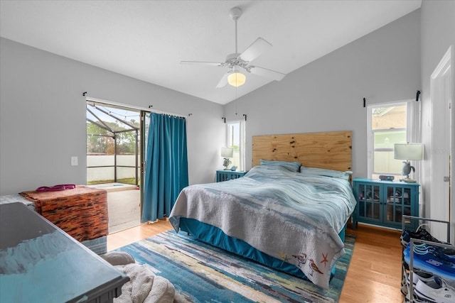 bedroom featuring ceiling fan, vaulted ceiling, and light hardwood / wood-style flooring