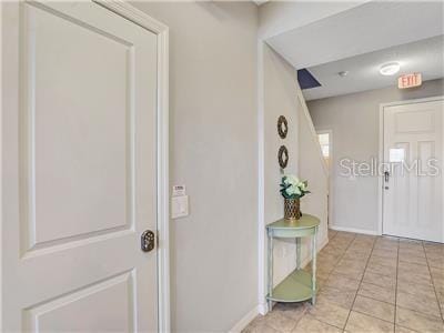 foyer with light tile patterned floors