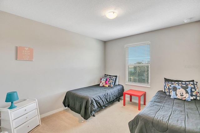 carpeted bedroom with a textured ceiling