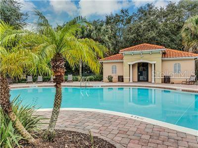 view of pool with an outbuilding