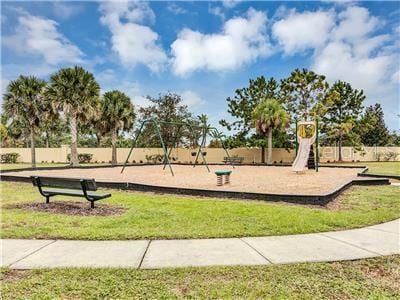 surrounding community with a playground and a lawn