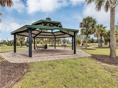 view of home's community with a yard and a gazebo