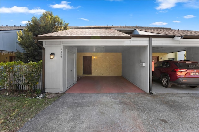 garage featuring a carport