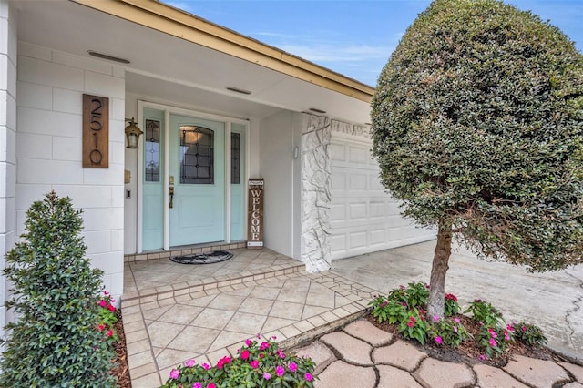 doorway to property featuring a garage