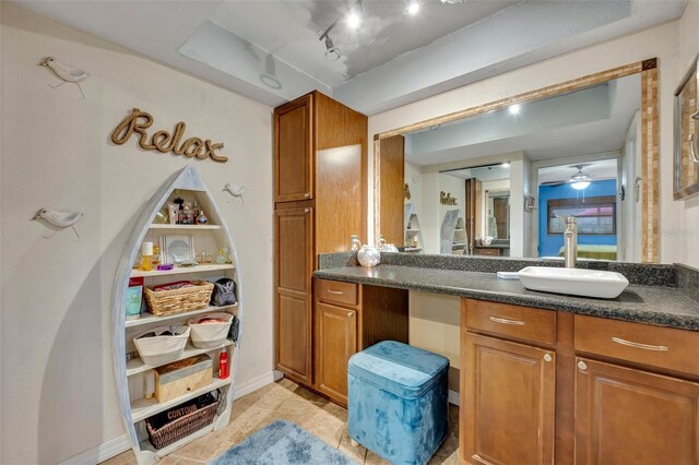 bathroom featuring ceiling fan, tile patterned floors, and vanity