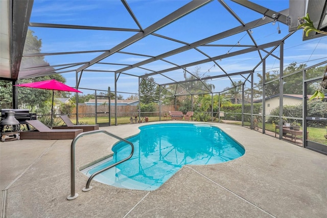 view of swimming pool with glass enclosure, a patio area, and a grill