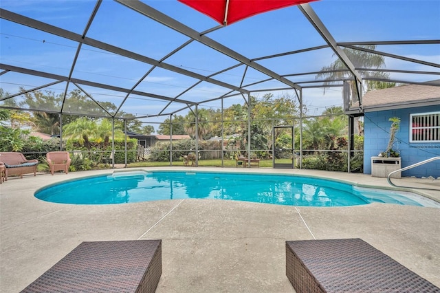 view of swimming pool with a patio and glass enclosure