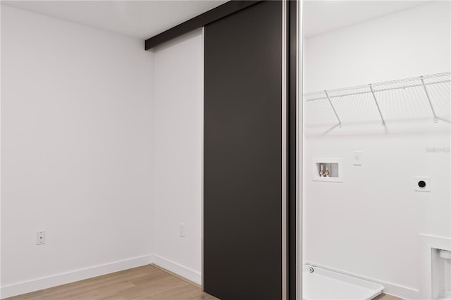 laundry area with washer hookup, hardwood / wood-style flooring, and electric dryer hookup