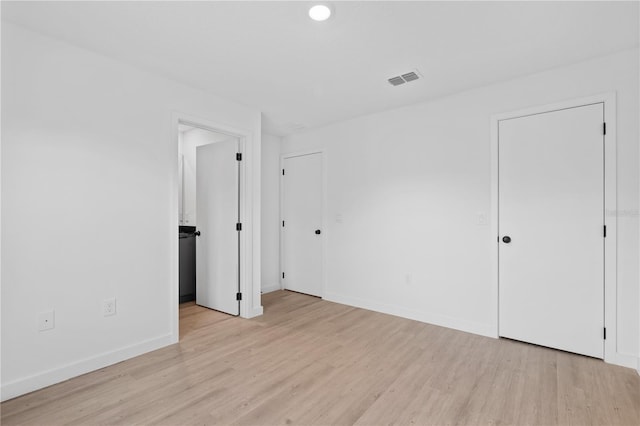 empty room with light wood-type flooring