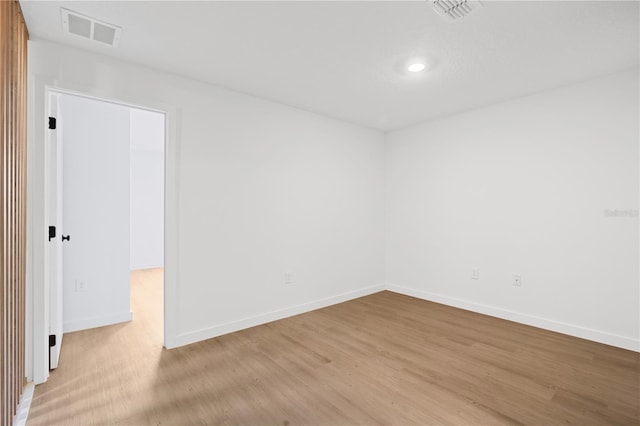 empty room featuring light hardwood / wood-style floors