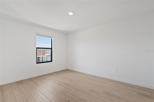 unfurnished room featuring light wood-type flooring