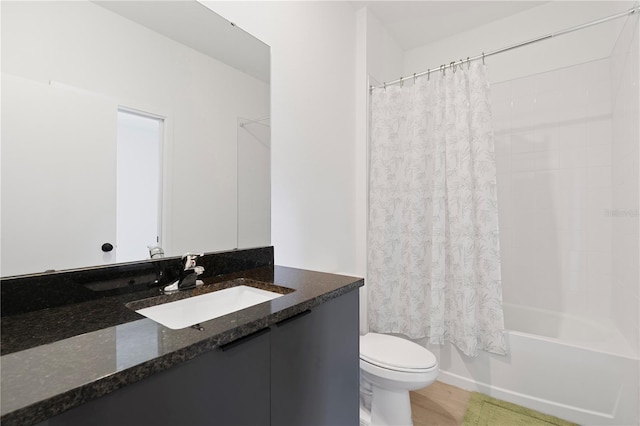 full bathroom with toilet, vanity, and shower / bath combination with curtain