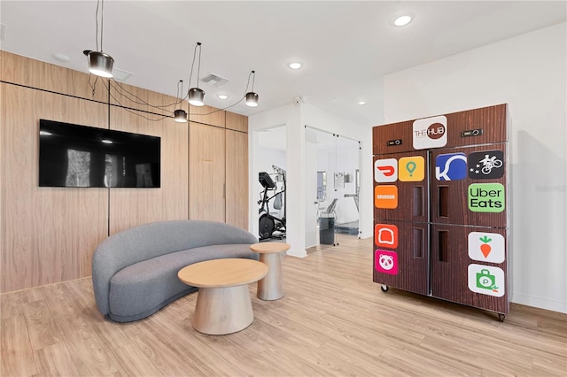 game room with light hardwood / wood-style floors