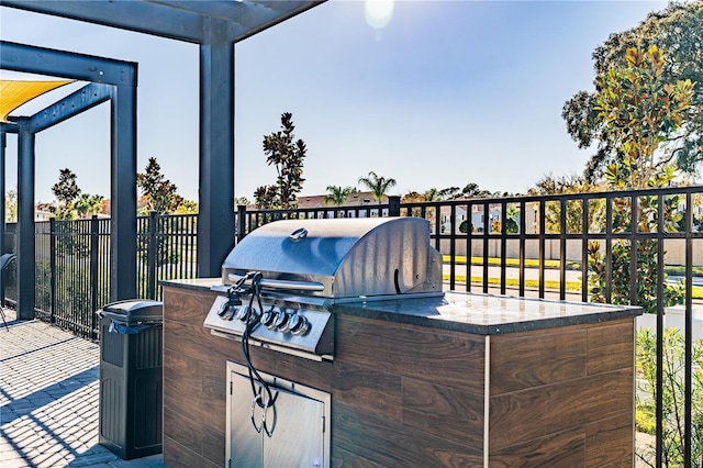 view of patio with an outdoor kitchen and grilling area