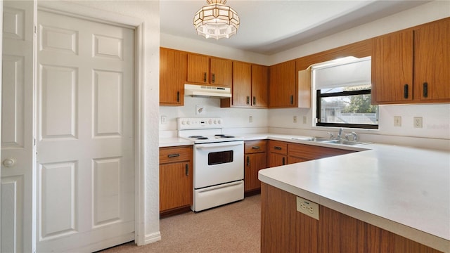 kitchen with white range with electric stovetop, sink, and decorative light fixtures