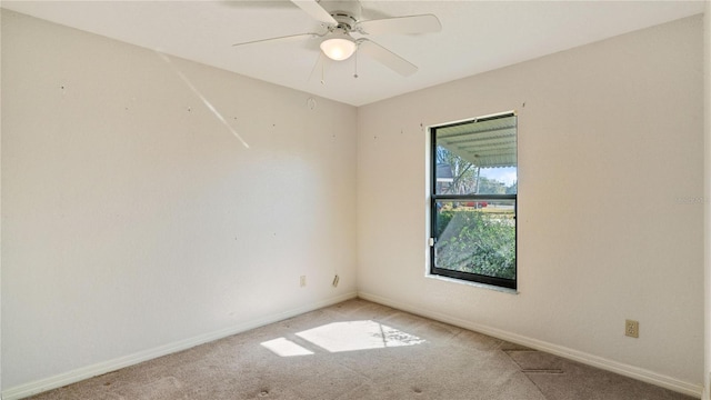 carpeted empty room with ceiling fan