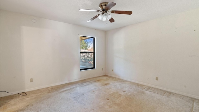 unfurnished room with light carpet and ceiling fan