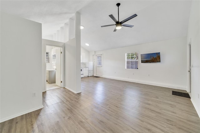 unfurnished living room featuring light wood-type flooring, ceiling fan, and vaulted ceiling