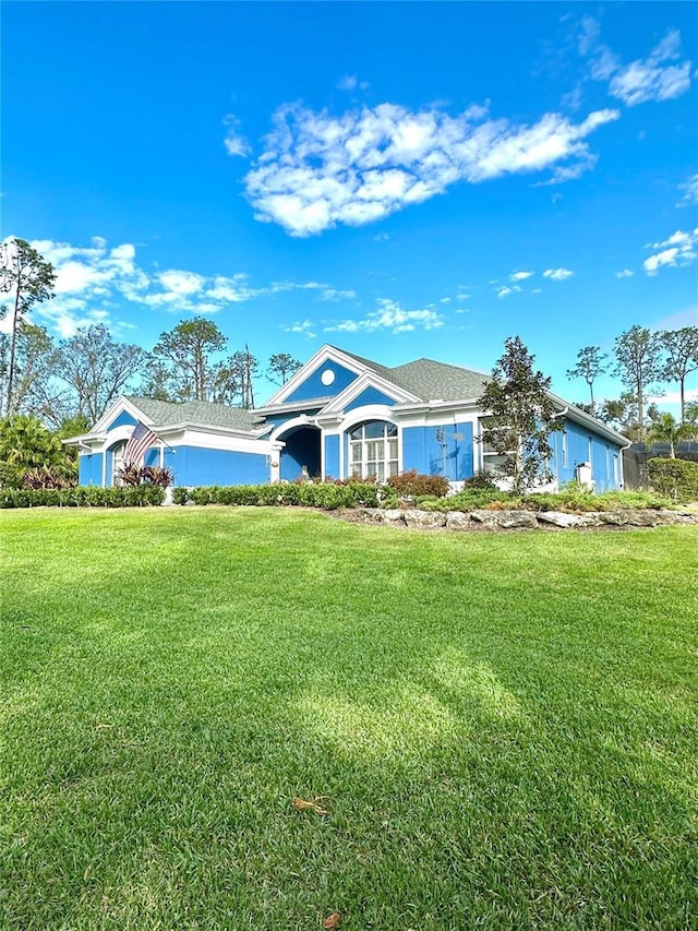 ranch-style house with a front lawn