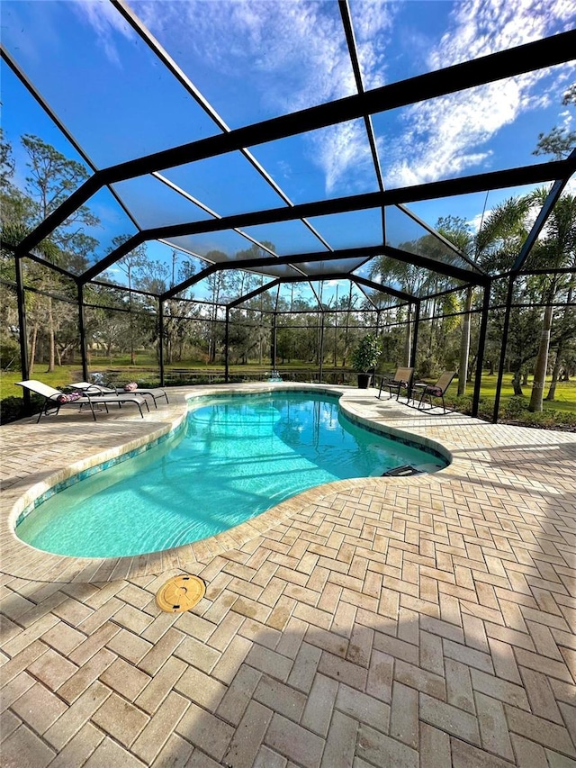 view of pool featuring a lanai and a patio area