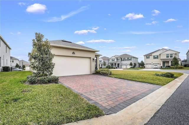 view of home's exterior with a garage and a yard