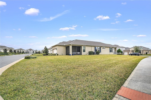 ranch-style home featuring a front yard