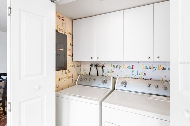 laundry area with cabinets, electric panel, and washing machine and clothes dryer