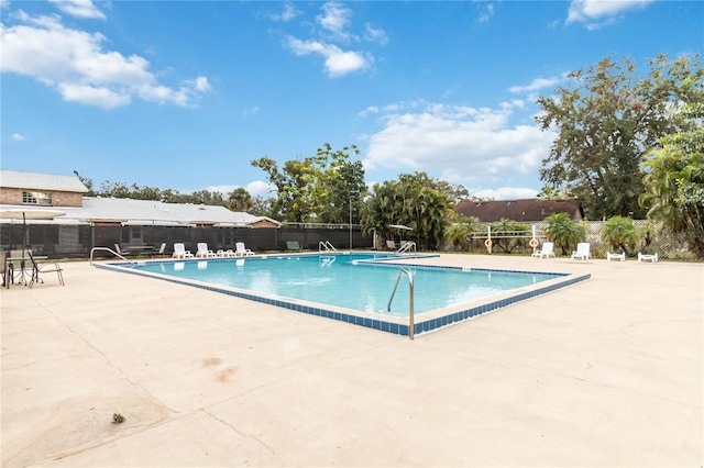 view of swimming pool featuring a patio area