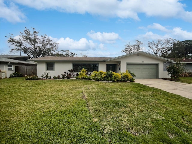 ranch-style home with a garage and a front yard