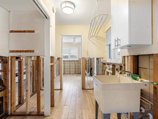 interior space with light wood-type flooring and sink