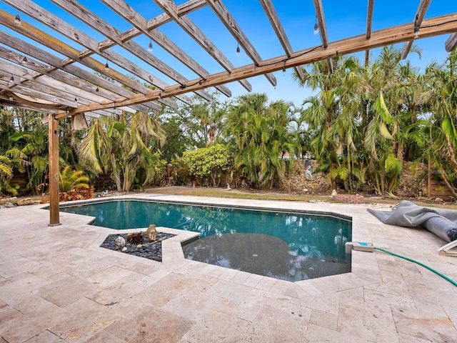 view of pool with a pergola and a patio area