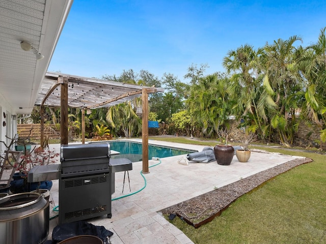 view of swimming pool with a patio area, a grill, and a pergola