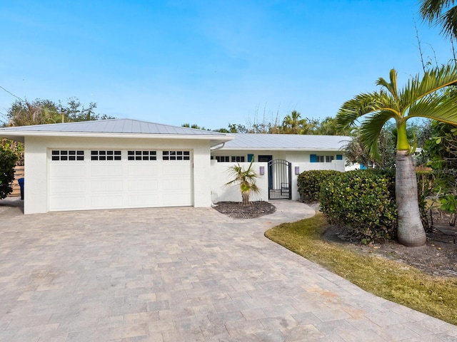 single story home with a garage