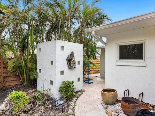 view of side of property featuring a patio area