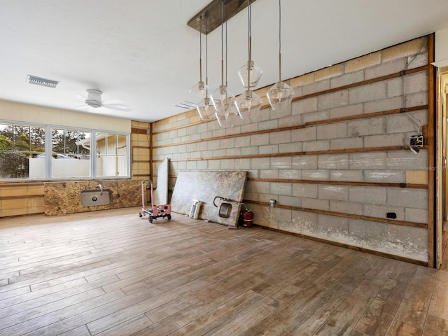 interior space featuring ceiling fan and hardwood / wood-style floors