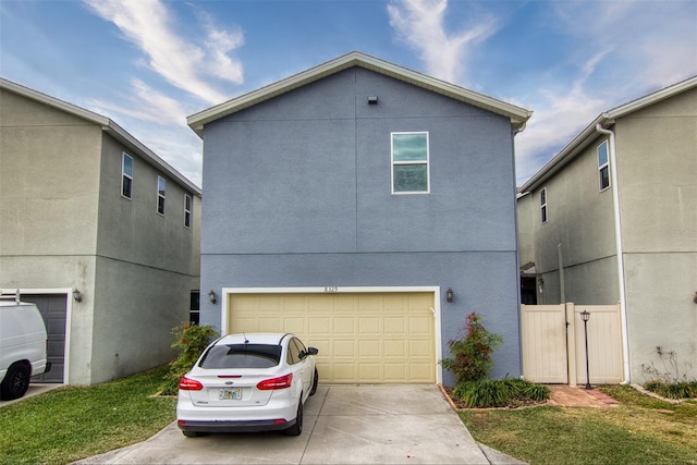 exterior space featuring a front yard and a garage