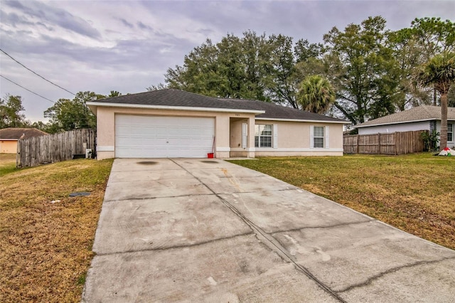 ranch-style home with a front yard and a garage