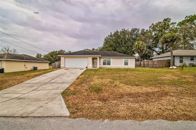 ranch-style home featuring a garage and a front lawn